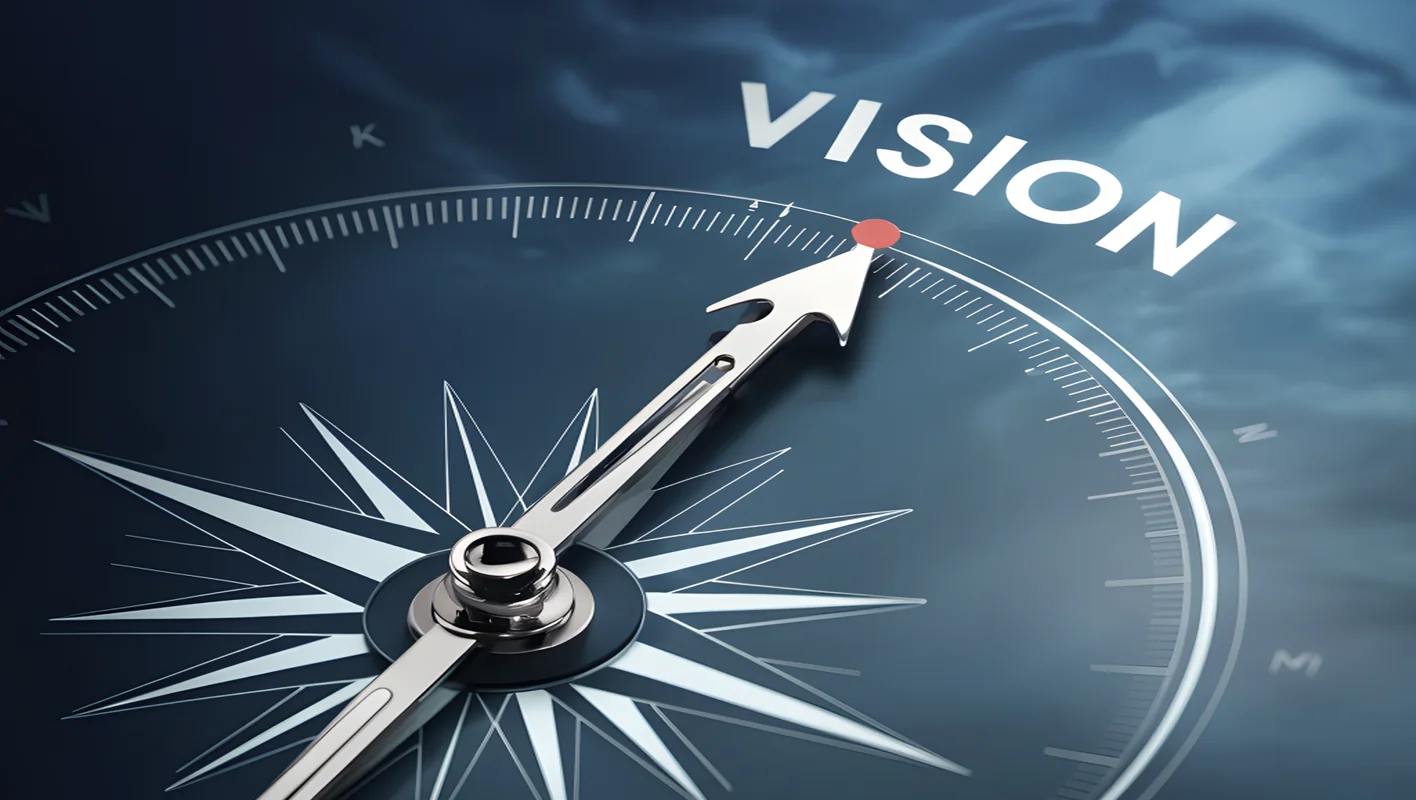 La bàn chỉ hướng chữ VISION — tầm nhìn
